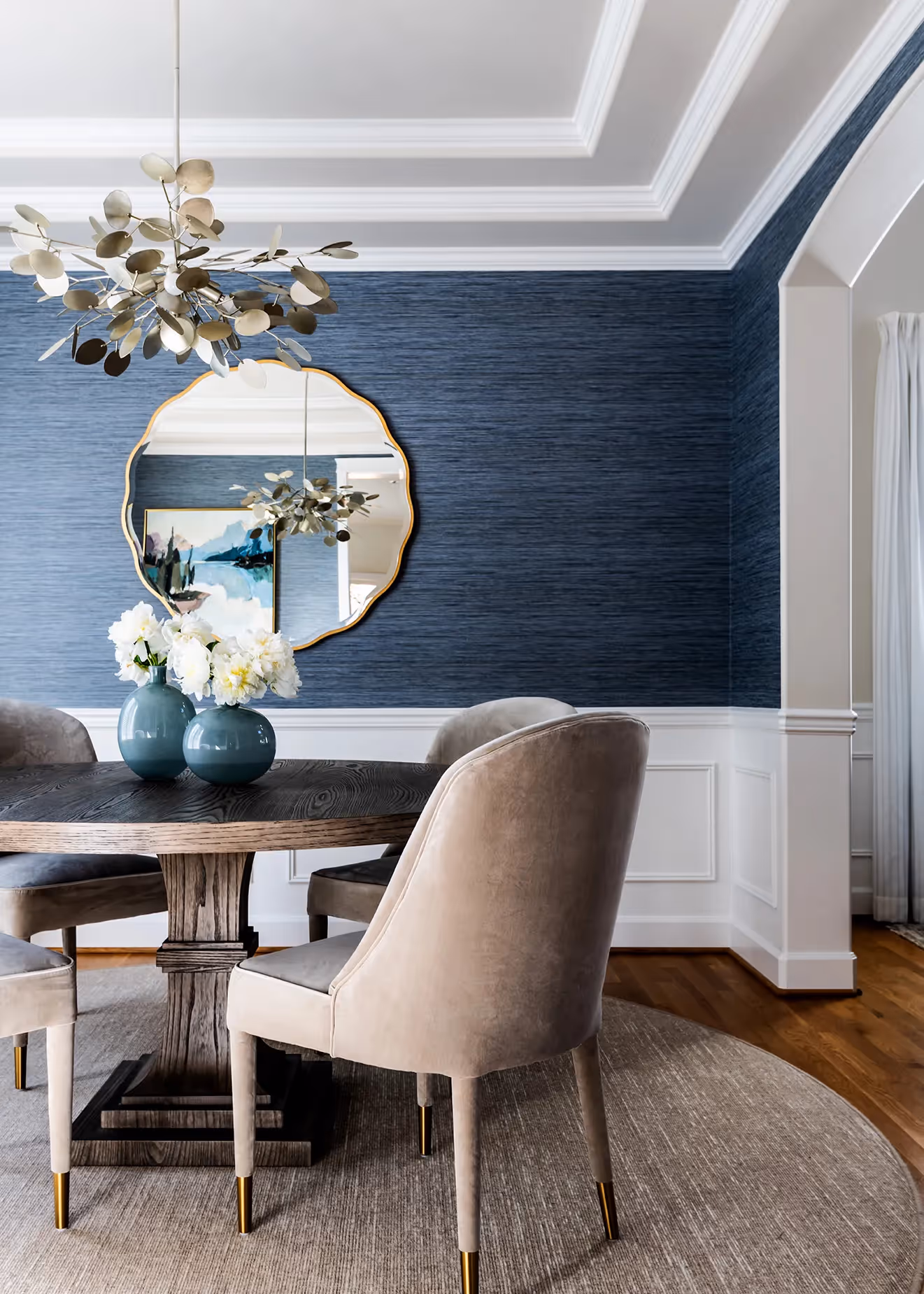 A full refresh of the entry, living, dining, and family rooms in an Edmonds, WA home — custom rugs, drapery, wallpaper, and curated art throughout.