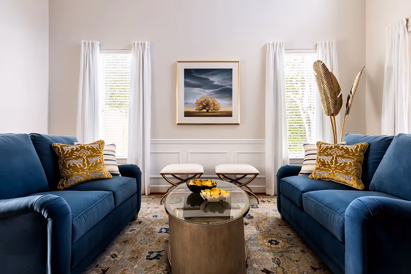 A full refresh of the entry, living, dining, and family rooms in an Edmonds, WA home — custom rugs, drapery, wallpaper, and curated art throughout.