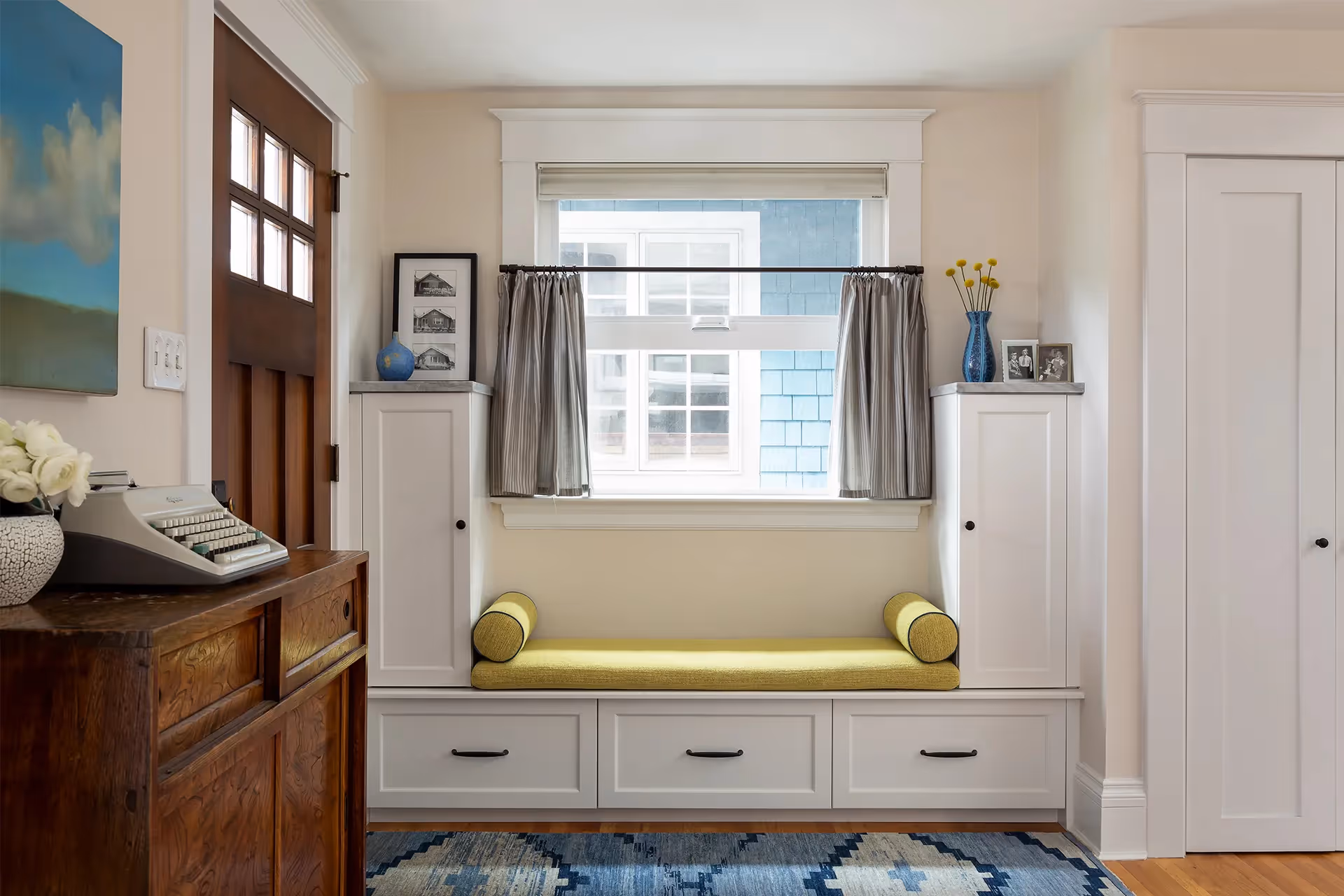 A 1920s craftsman restoration in Capitol Hill, Seattle — gas fireplace retrofit, quartzite surround, bold saturated textiles, and custom period built-ins.