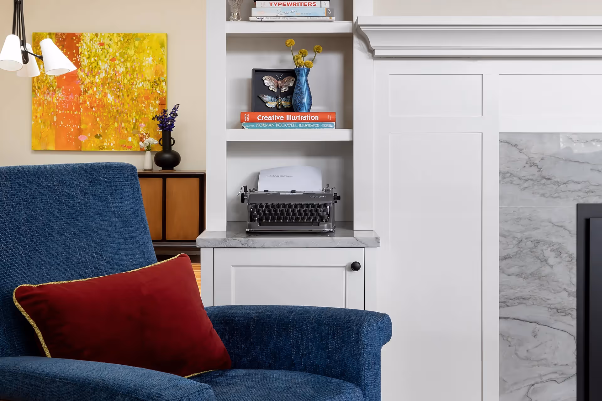 A 1920s craftsman restoration in Capitol Hill, Seattle — gas fireplace retrofit, quartzite surround, bold saturated textiles, and custom period built-ins.