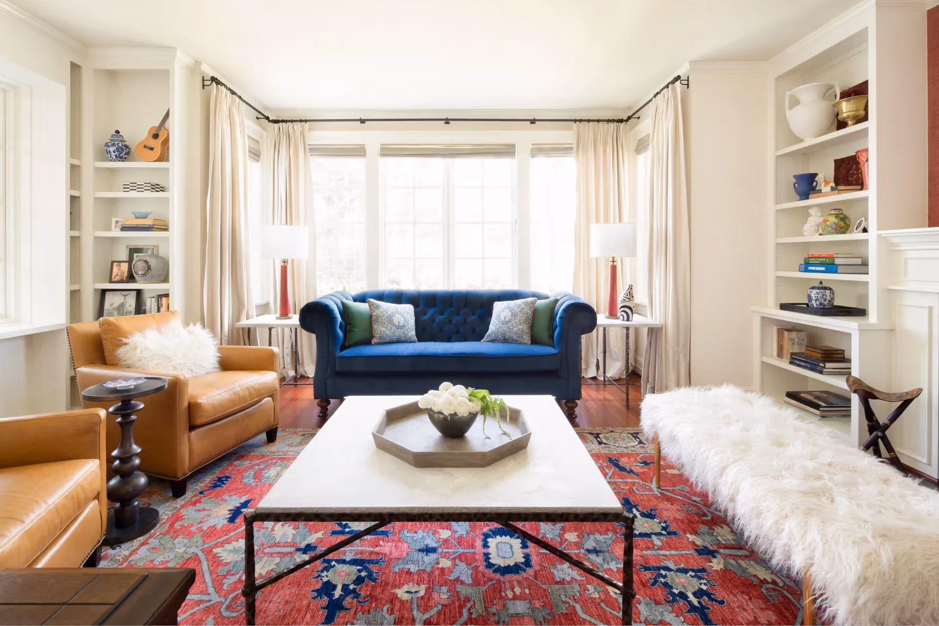 A gracious living and dining room for a Madison Park, Seattle home — vibrant color, old-world styling, and eclectic furnishings for a family of four.