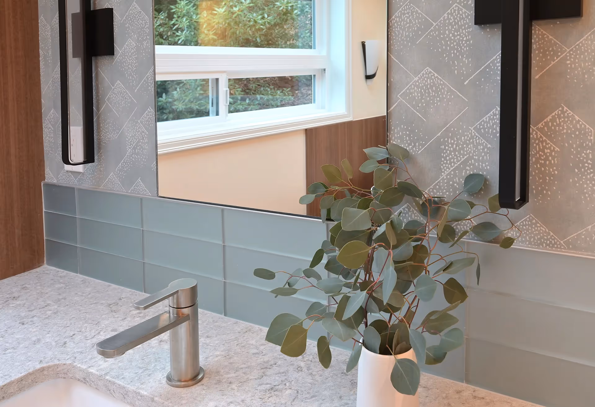 A nature-inspired master bath remodel on Mercer Island — stand-alone tub, his-and-her vanities, and panoramic water views through new horizontal windows.