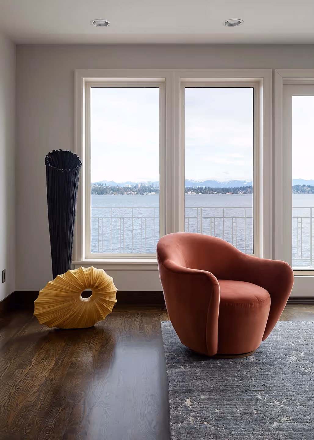 A serene living room, bedroom, and library refresh in Seattle's Madrona neighborhood — water-inspired palette, custom fiber art, and bespoke furnishings.