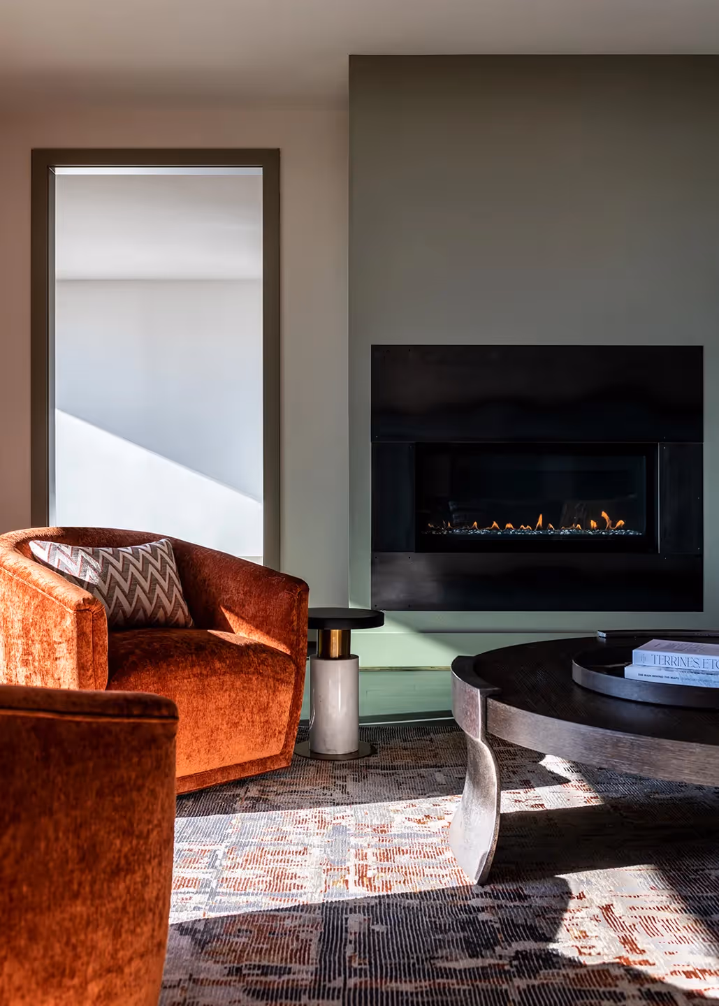 A whole-home transformation in Seattle's Magnolia neighborhood — living room, kitchen, deck, and dining room with sweeping water views and local art.