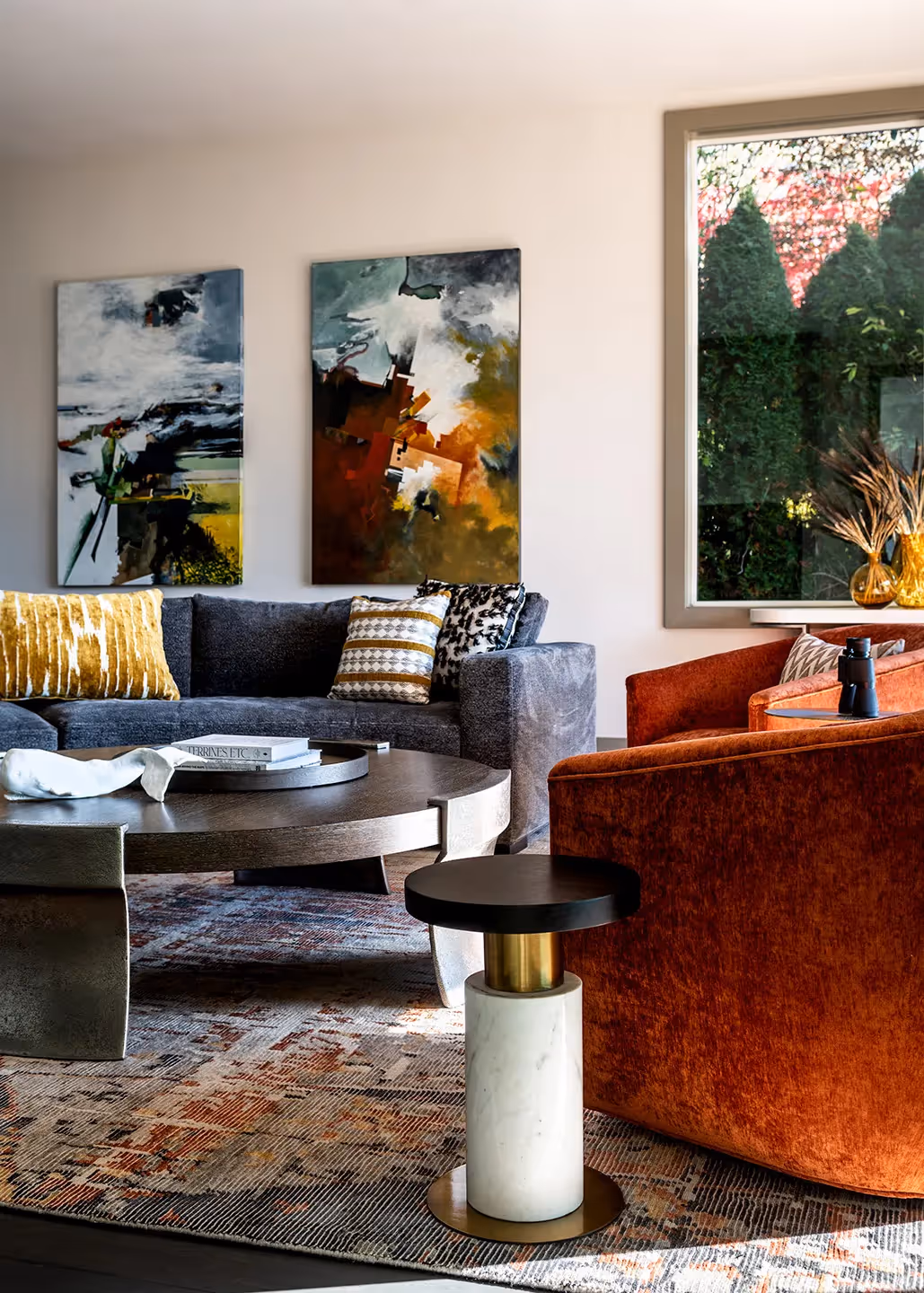 A whole-home transformation in Seattle's Magnolia neighborhood — living room, kitchen, deck, and dining room with sweeping water views and local art.