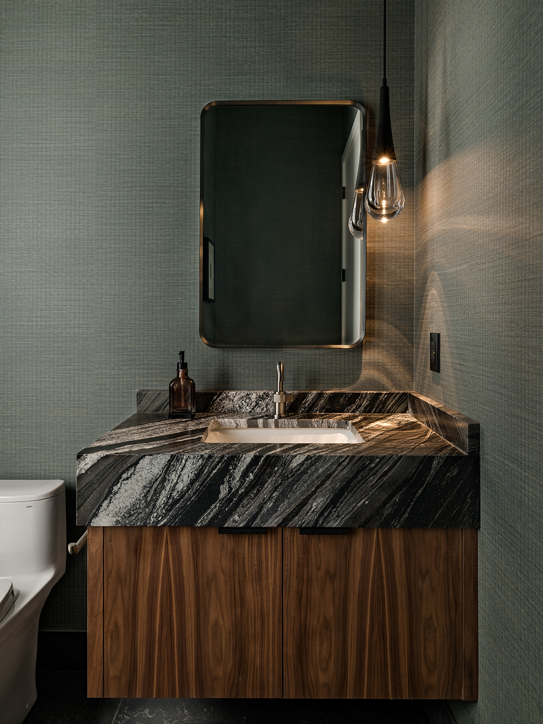 A Zen-inspired full remodel of a mid-century modern home in North Seattle — bookmatched cabinetry, quartzite countertops, and custom furnishings.
