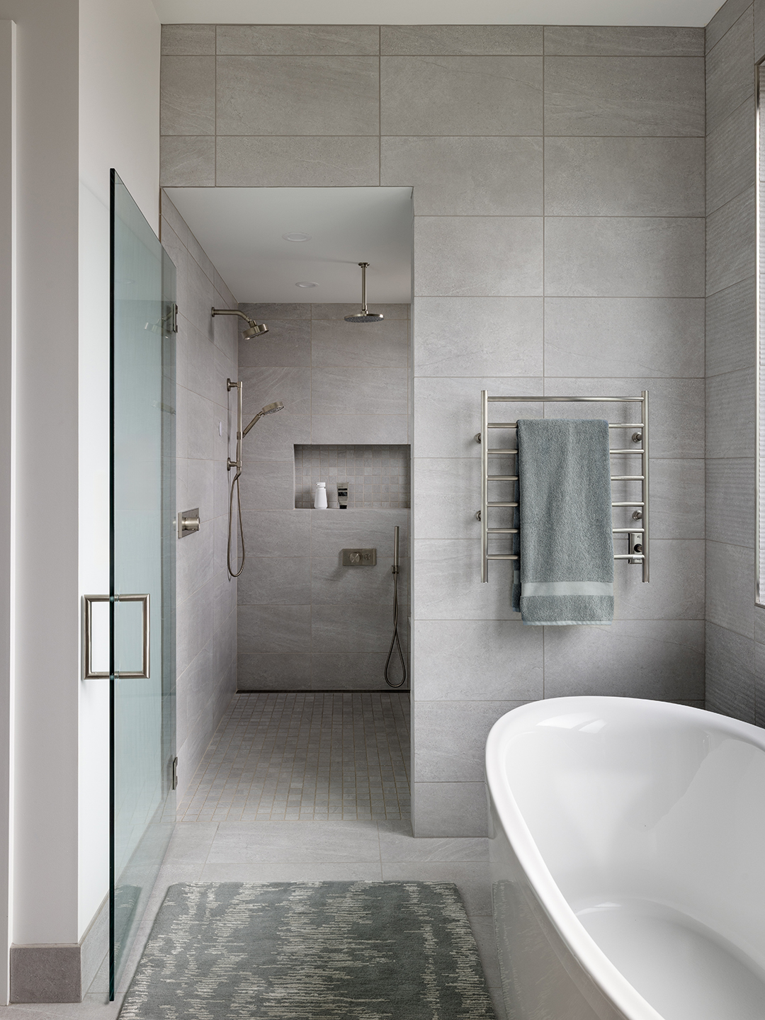 A Zen-inspired full remodel of a mid-century modern home in North Seattle — bookmatched cabinetry, quartzite countertops, and custom furnishings.