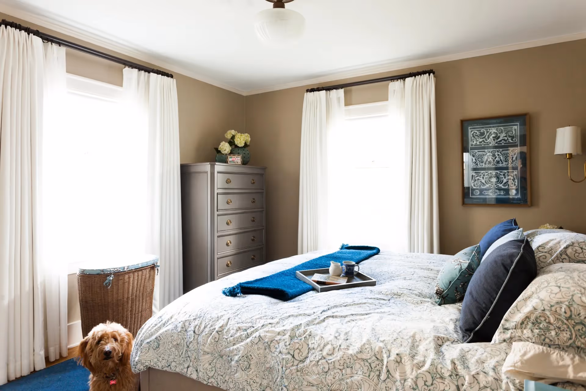 A whole-home update for a Seattle bungalow in Phinney Ridge — blue-toned palette, vintage antiques, custom furnishings, and family-friendly design.