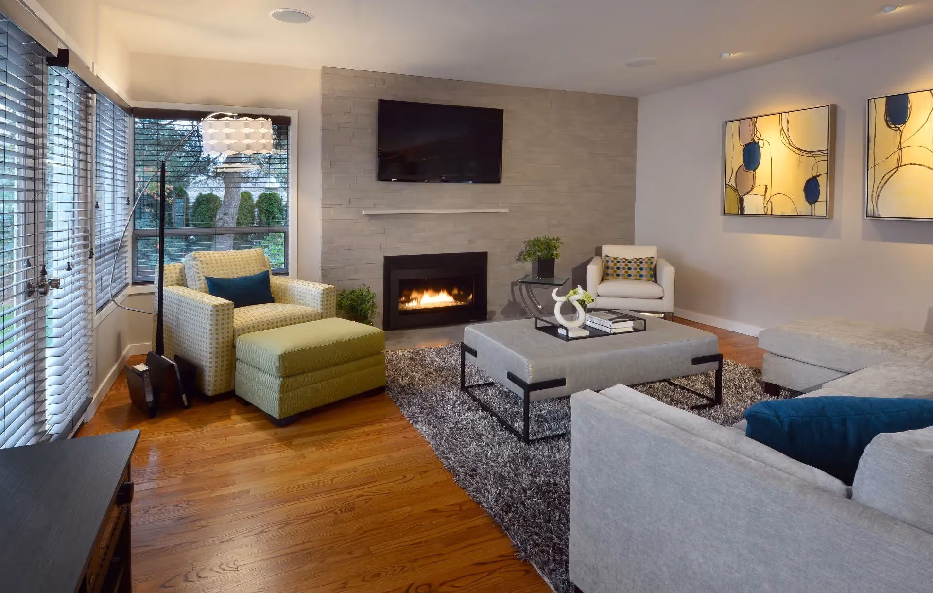 A Remodeling Excellence Award-winning kitchen and family room remodel in Mill Creek — open floorplan, wine storage, and a custom waterfall quartz table.