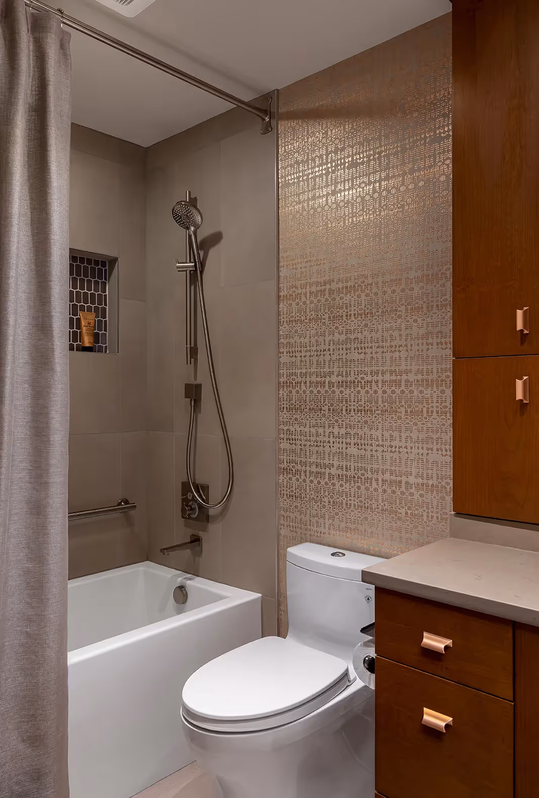 A luxe hall bathroom remodel in Sunset Hill, Seattle — mixed metals, African mahogany cabinetry, and a custom shower curtain doubling as a powder room.