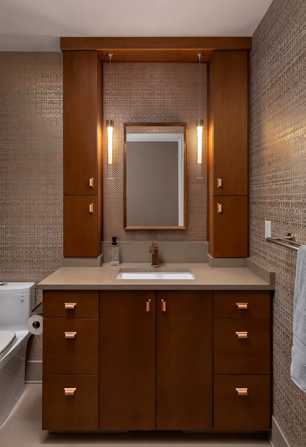 A luxe hall bathroom remodel in Sunset Hill, Seattle — mixed metals, African mahogany cabinetry, and a custom shower curtain doubling as a powder room.