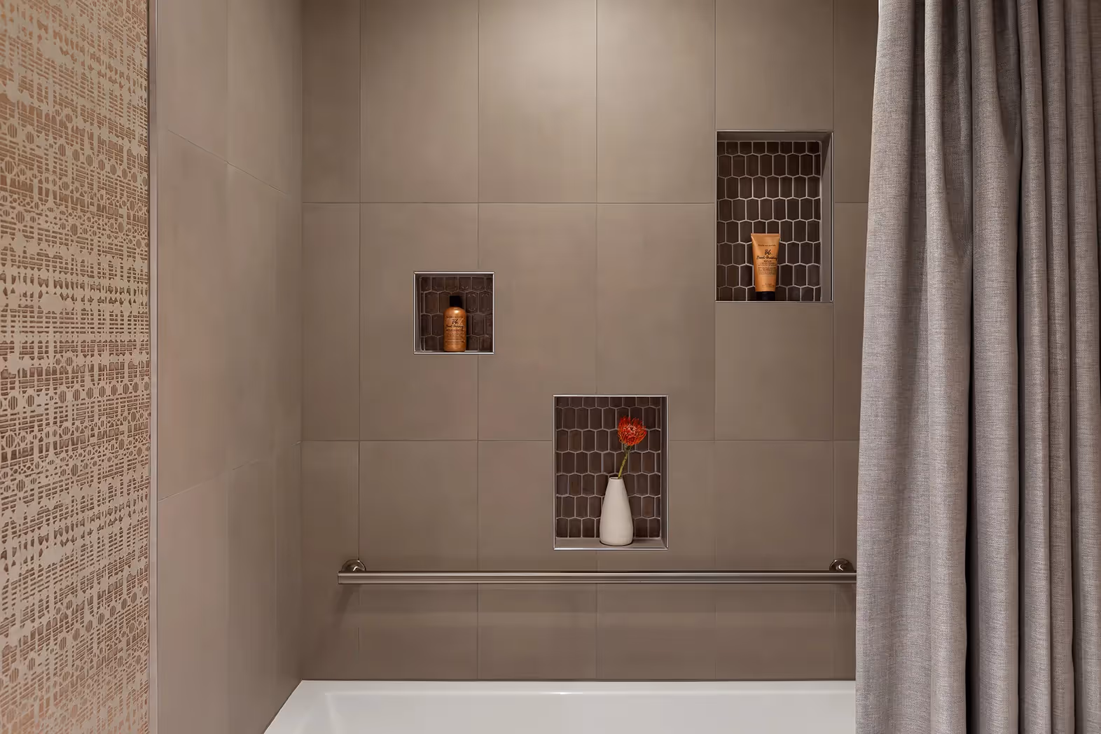 A luxe hall bathroom remodel in Sunset Hill, Seattle — mixed metals, African mahogany cabinetry, and a custom shower curtain doubling as a powder room.