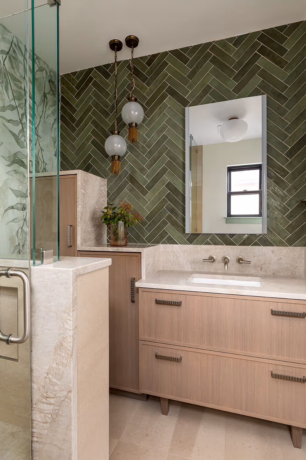 A down-to-studs guest bath remodel in Seattle's Central District — botanical mural, quartzite slab, and herringbone tile in a 1920s craftsman.