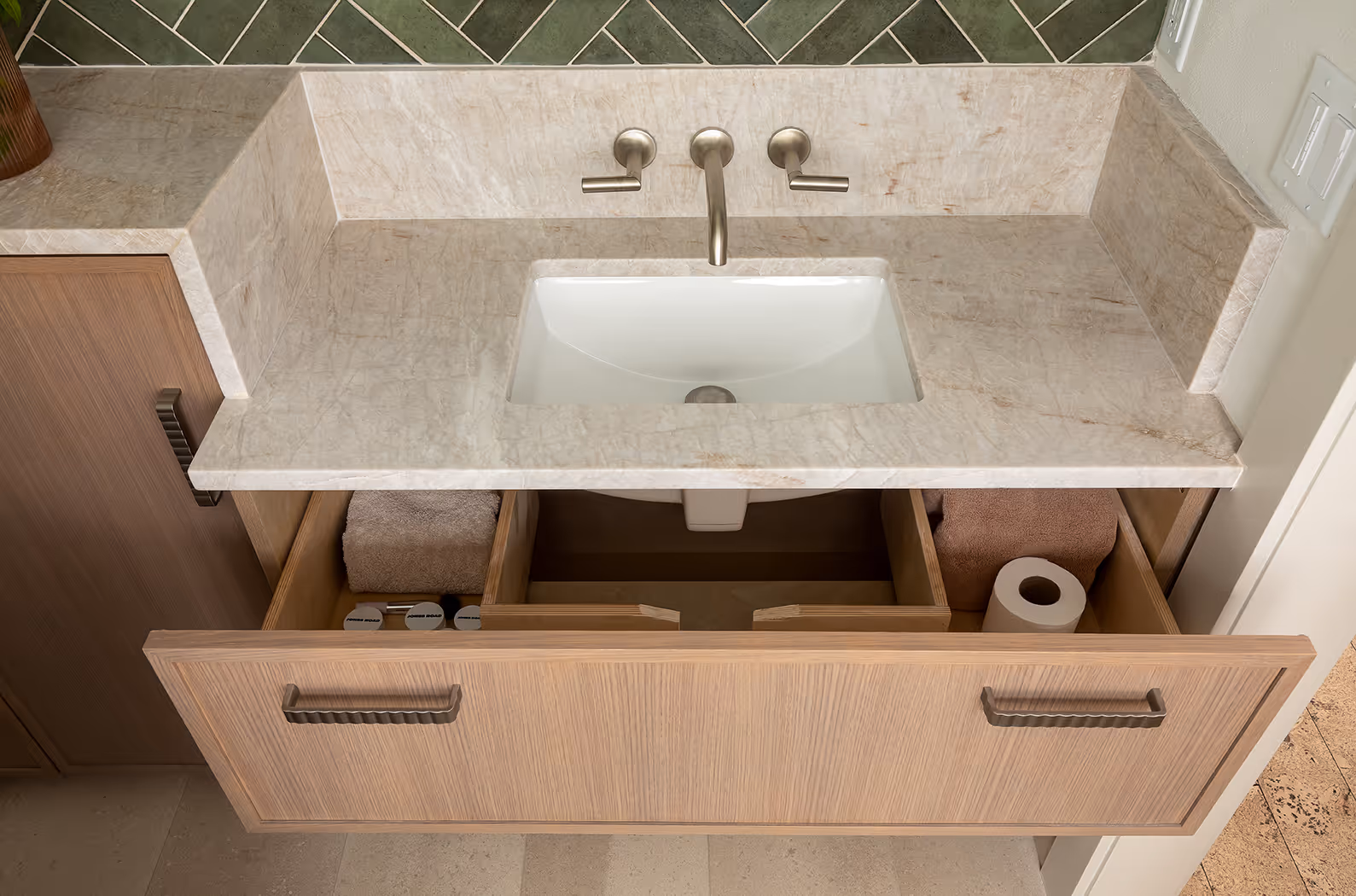 A down-to-studs guest bath remodel in Seattle's Central District — botanical mural, quartzite slab, and herringbone tile in a 1920s craftsman.
