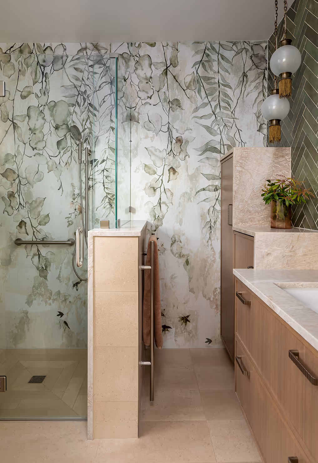 A down-to-studs guest bath remodel in Seattle's Central District — botanical mural, quartzite slab, and herringbone tile in a 1920s craftsman.