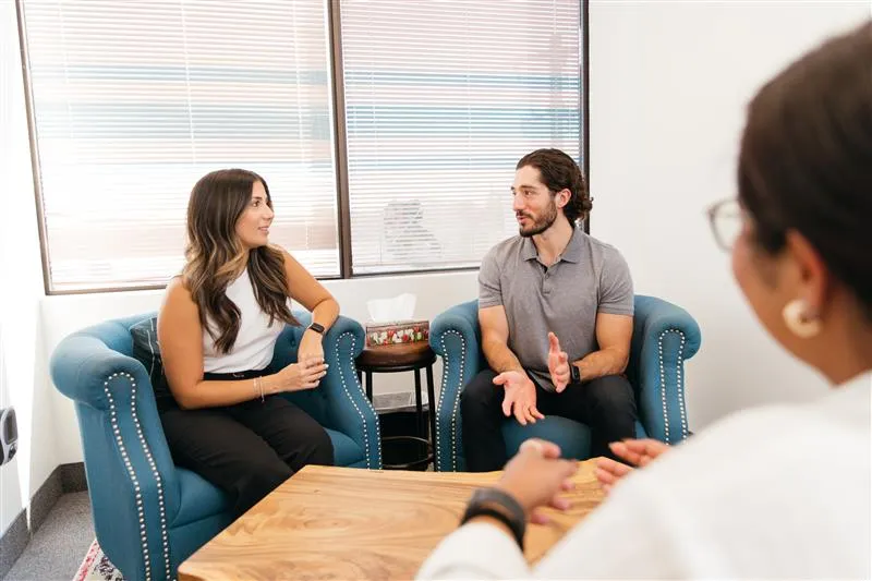 person sitting with psychotherapist