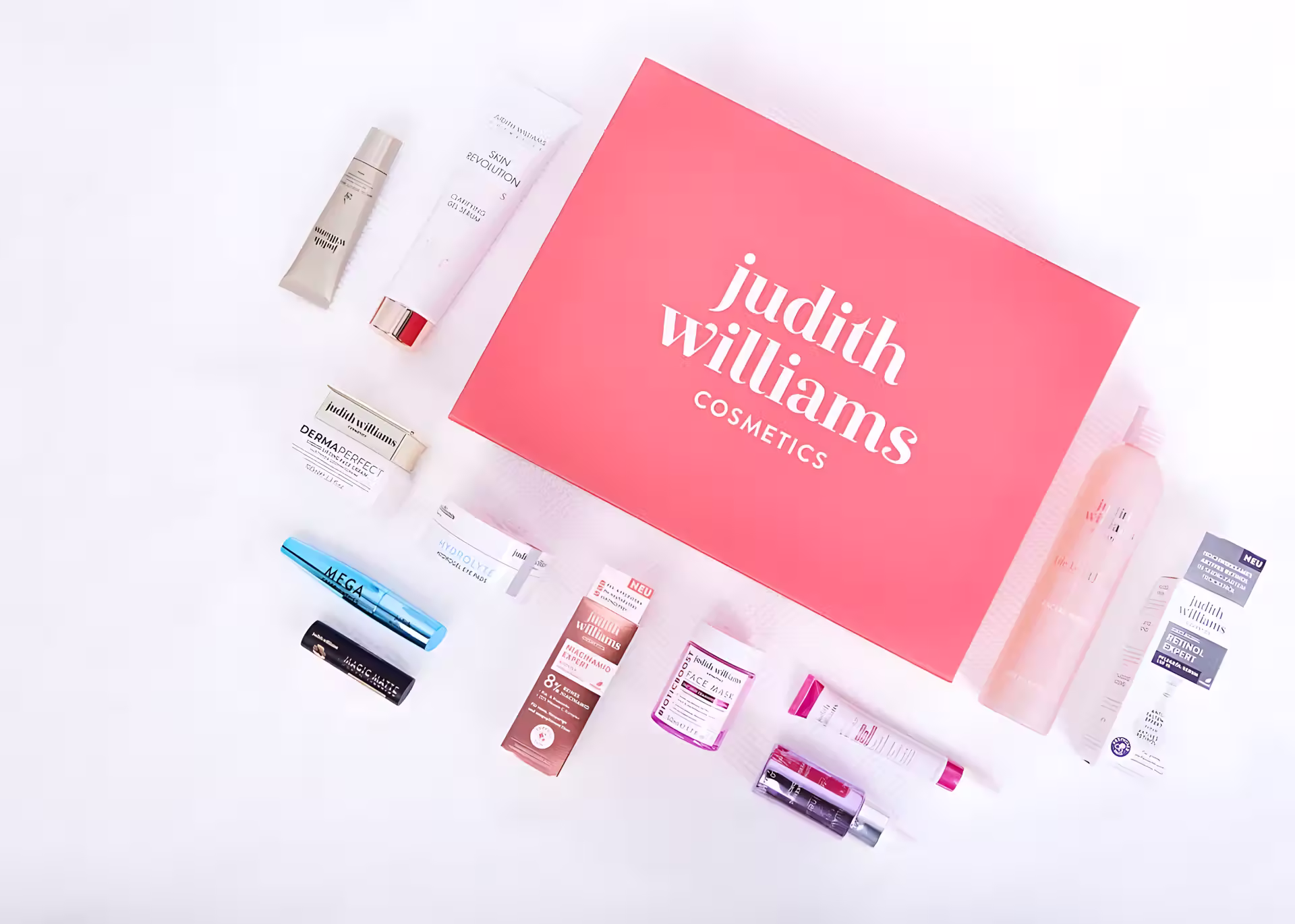 Judith Williams Cosmetics Markenpräsentation mit rosa Verpackungen und verschiedenen Hautpflegeprodukten auf weißer Oberfläche arrangiert
