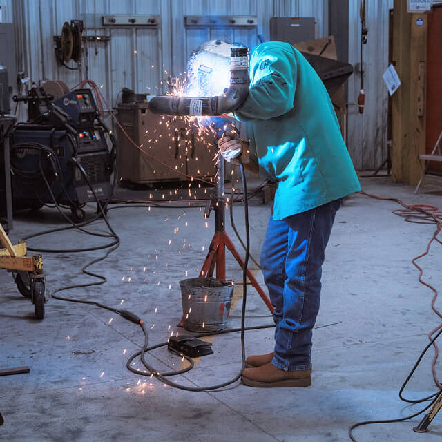 Welder working in a fabrication shop