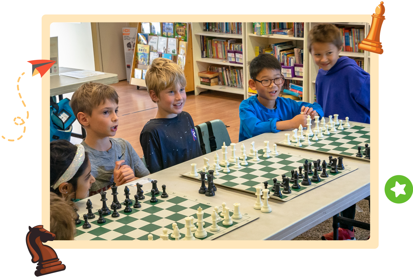 Children sitting at tables lined with chessboards during a class at the Palo Alto campus.