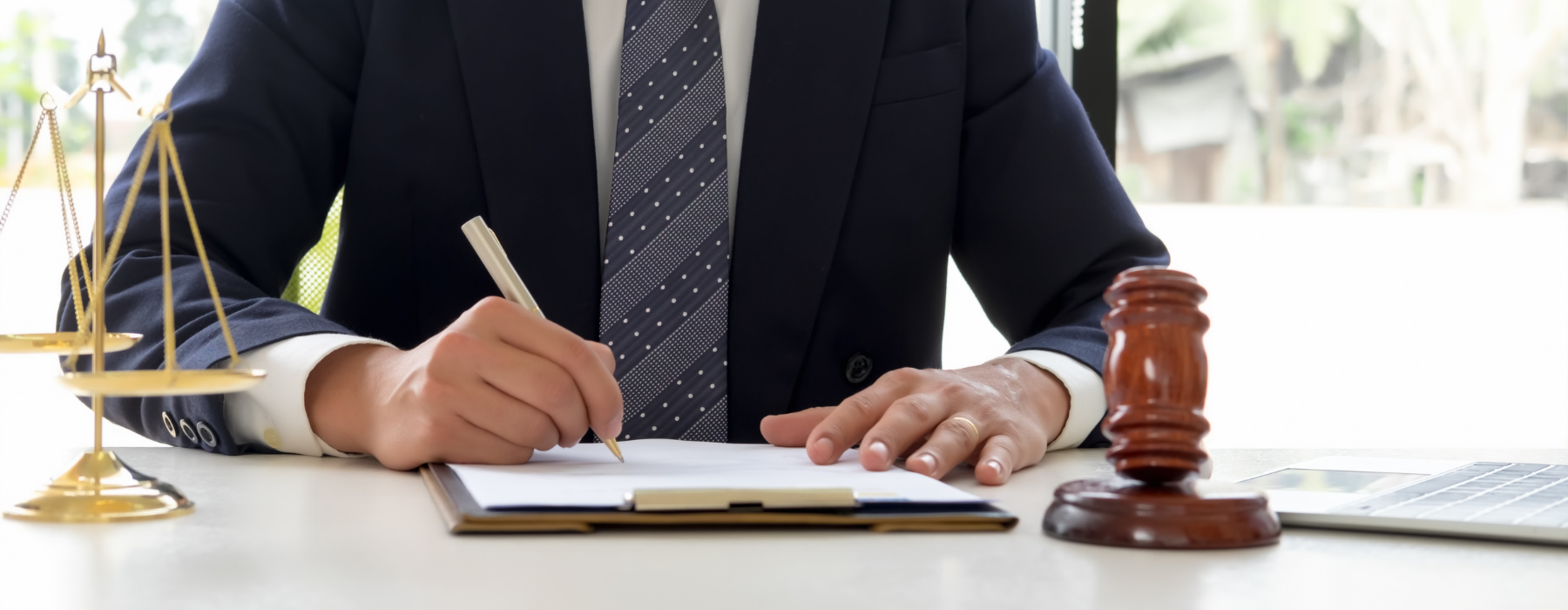 Ashland criminal defense lawyer preparing a legal defense strategy with court documents, gavel, and scales of justice in Ohio.
