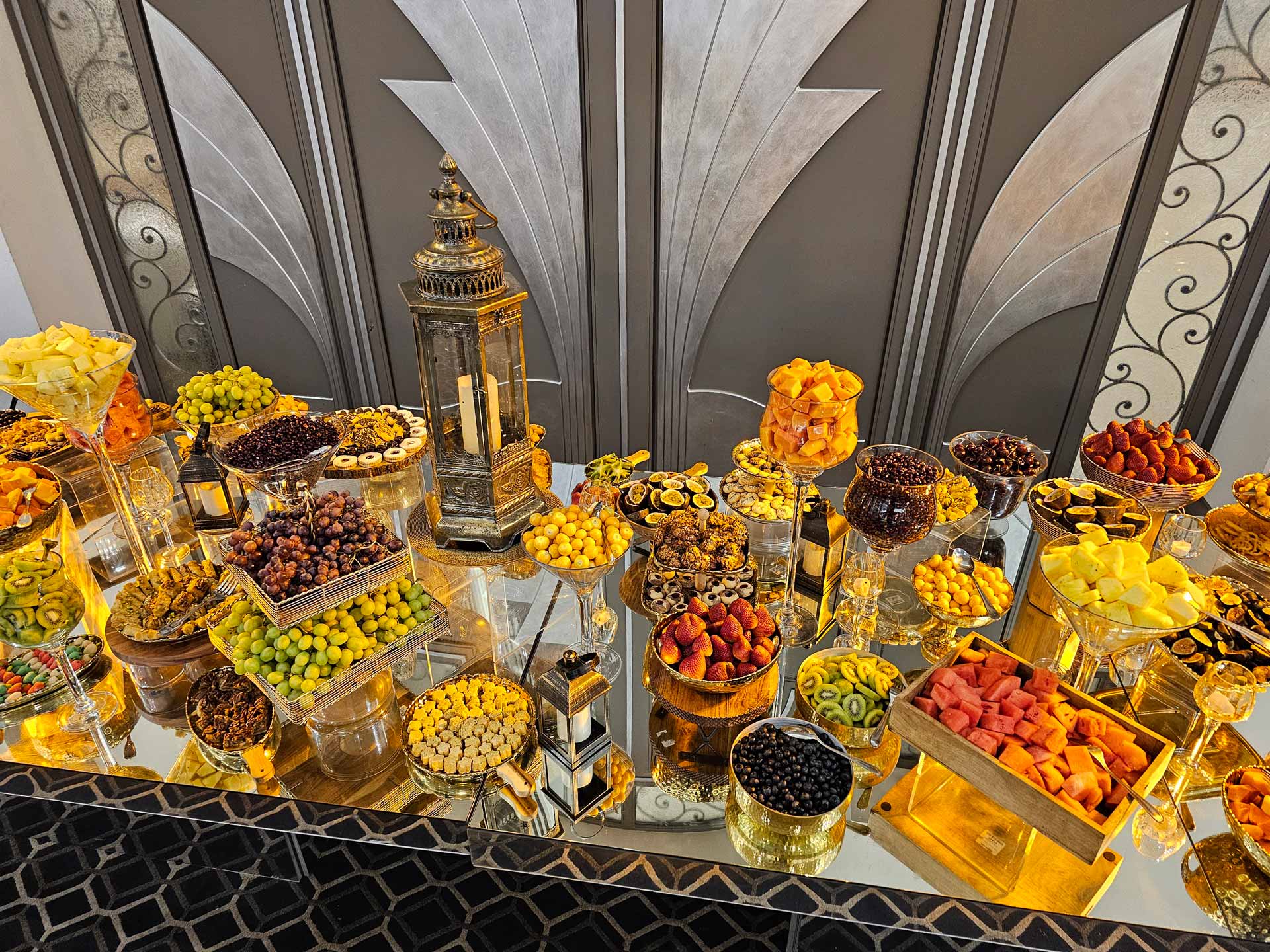 A banquet table laden with an array of foods, including appetizers, main courses, and desserts, creating a vibrant feast.