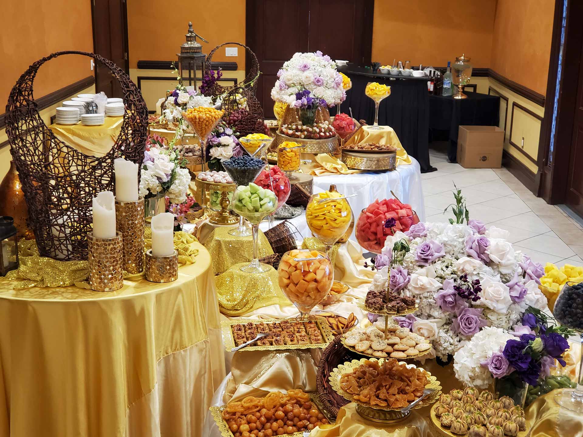 A diverse buffet table filled with an assortment of food items, showcasing colorful salads, entrees, and desserts.