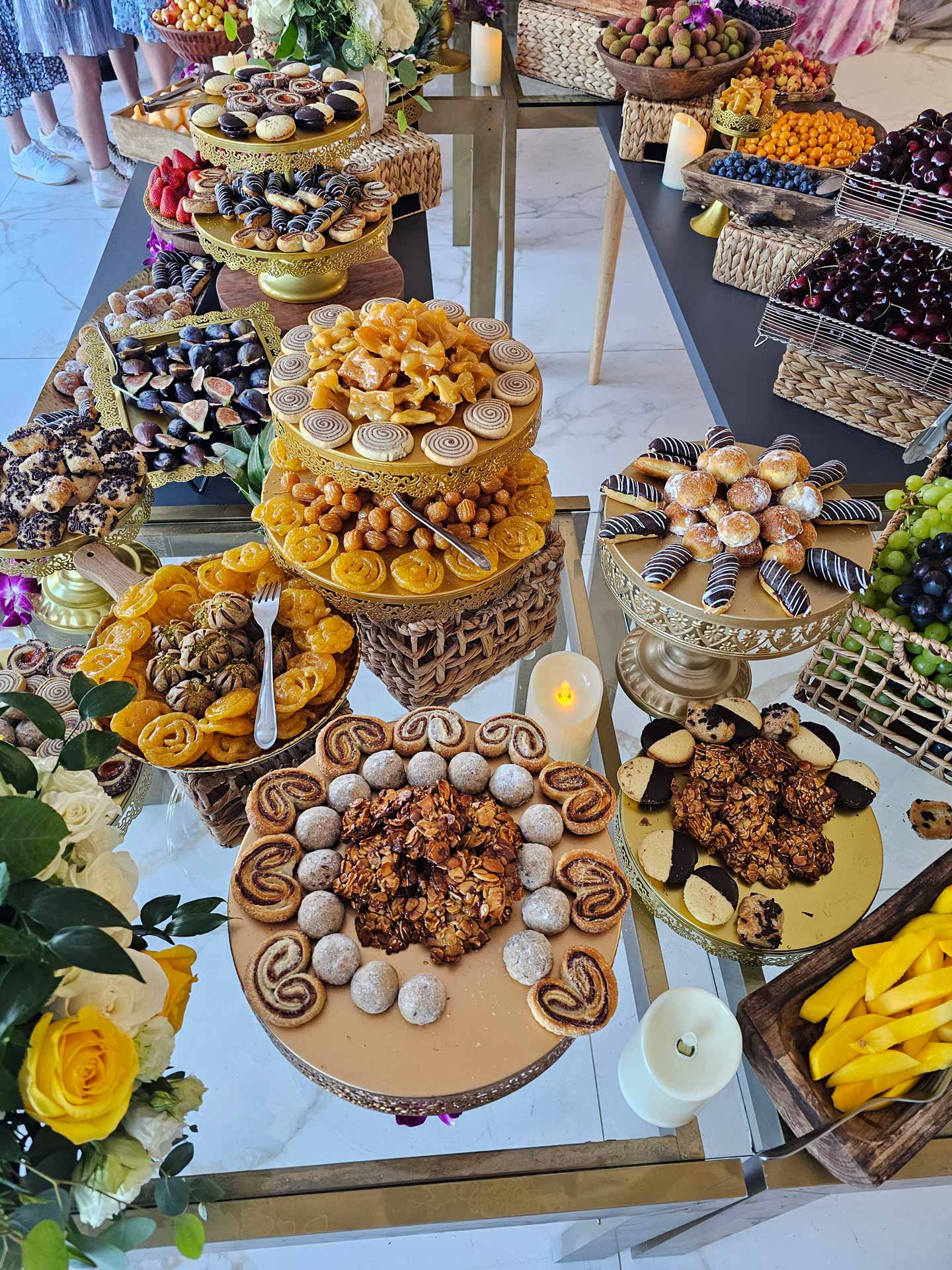 A diverse buffet table filled with an assortment of food items, showcasing colorful salads, entrees, and desserts.