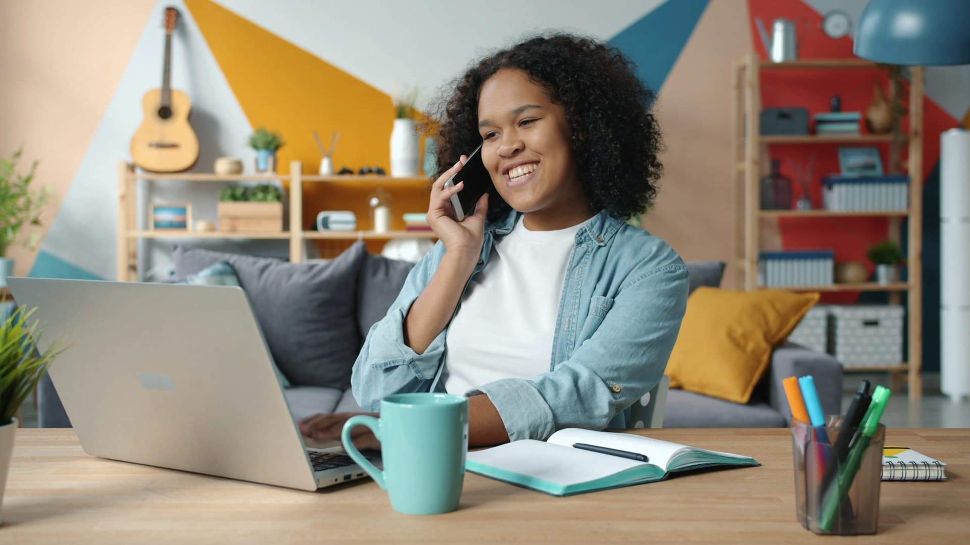 Overseas investor researching a UK buy-to-let limited company from home by phone and laptop