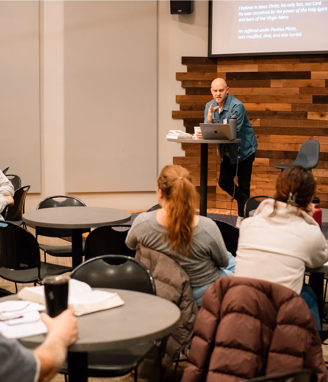 A man giving a presentation to a group of people.