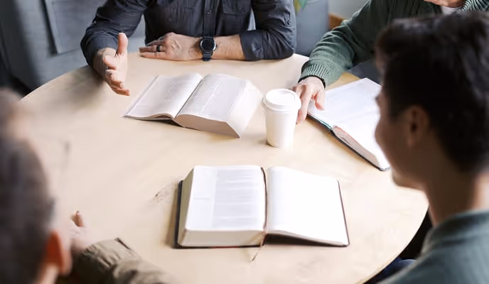 a group reading their bibles around a table