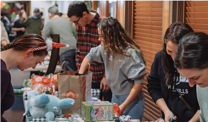 a group packing donation giveaway bags