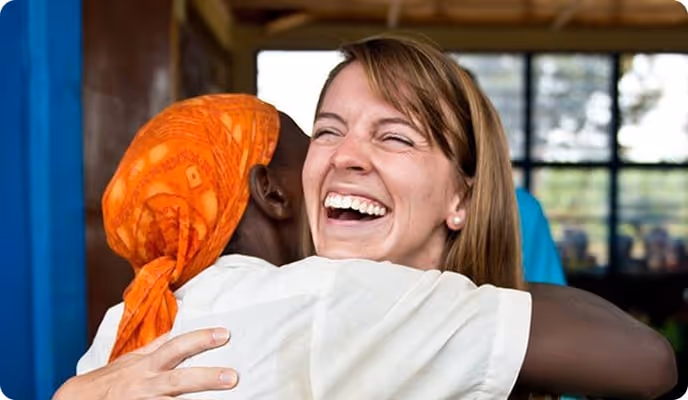 two women embrace in a hug
