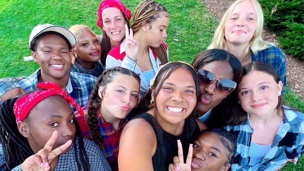 a group of teens taking a selfie