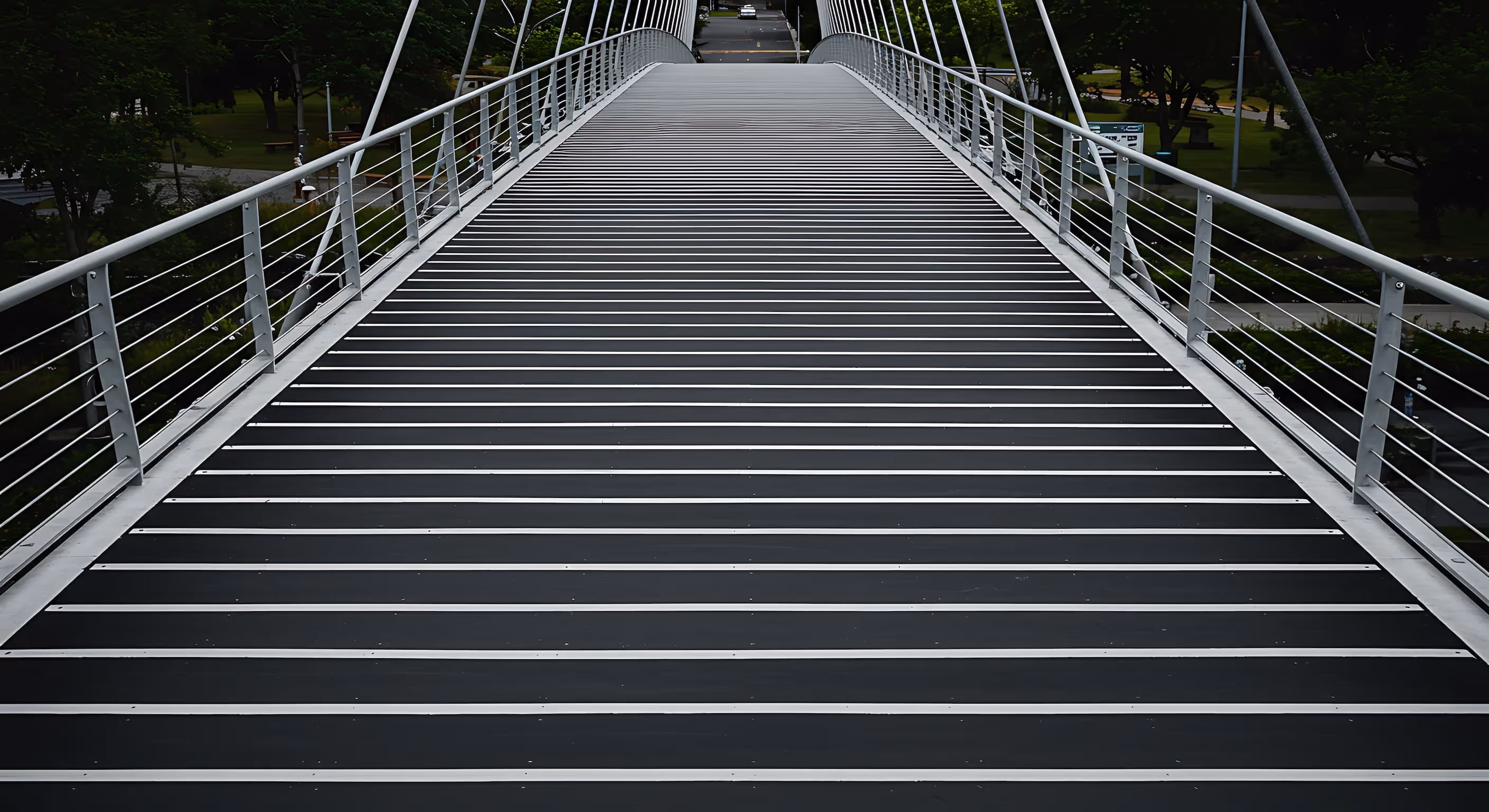 Rooftop bridge-style walkway system with guardrails