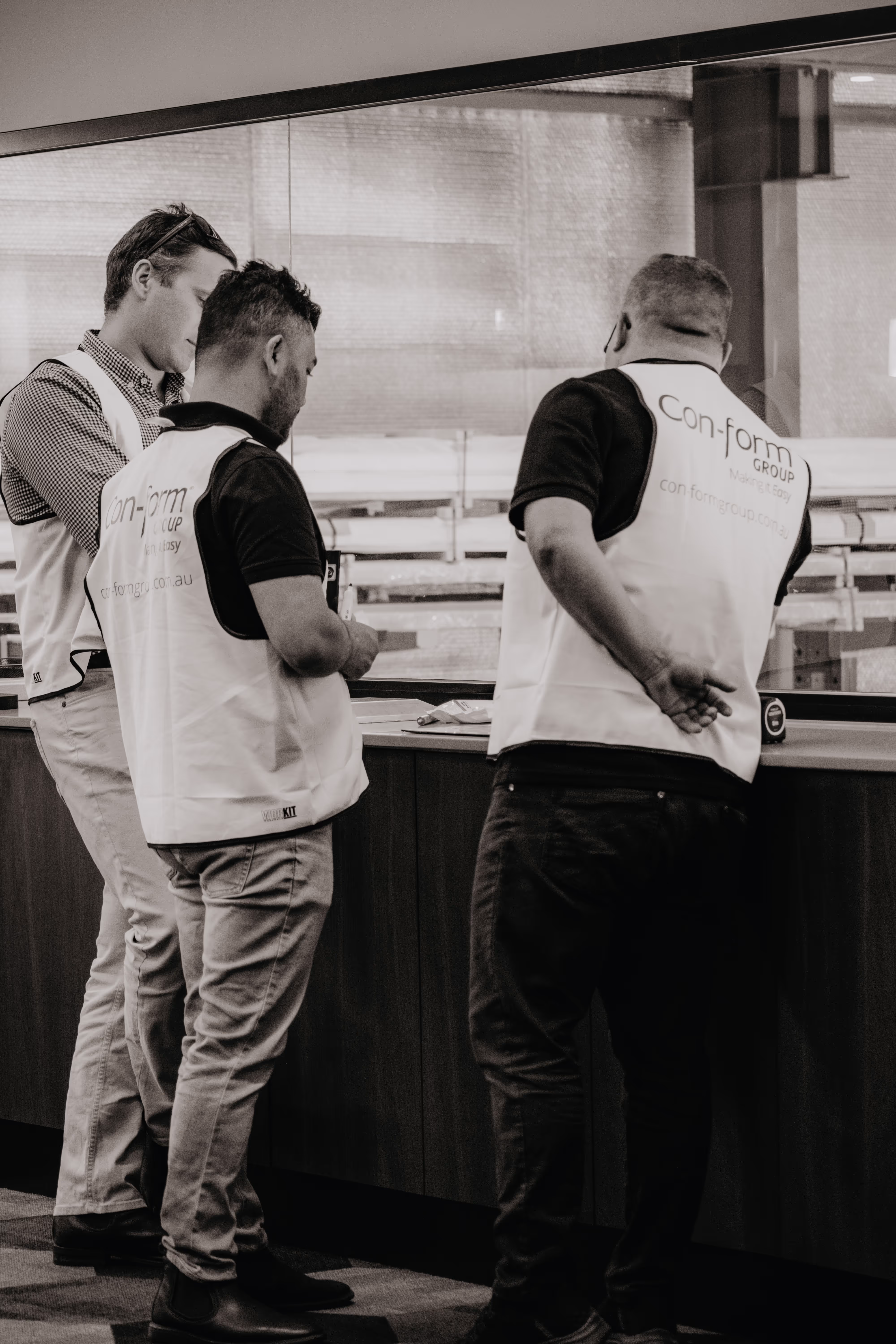 Con-form Group team members in conversation