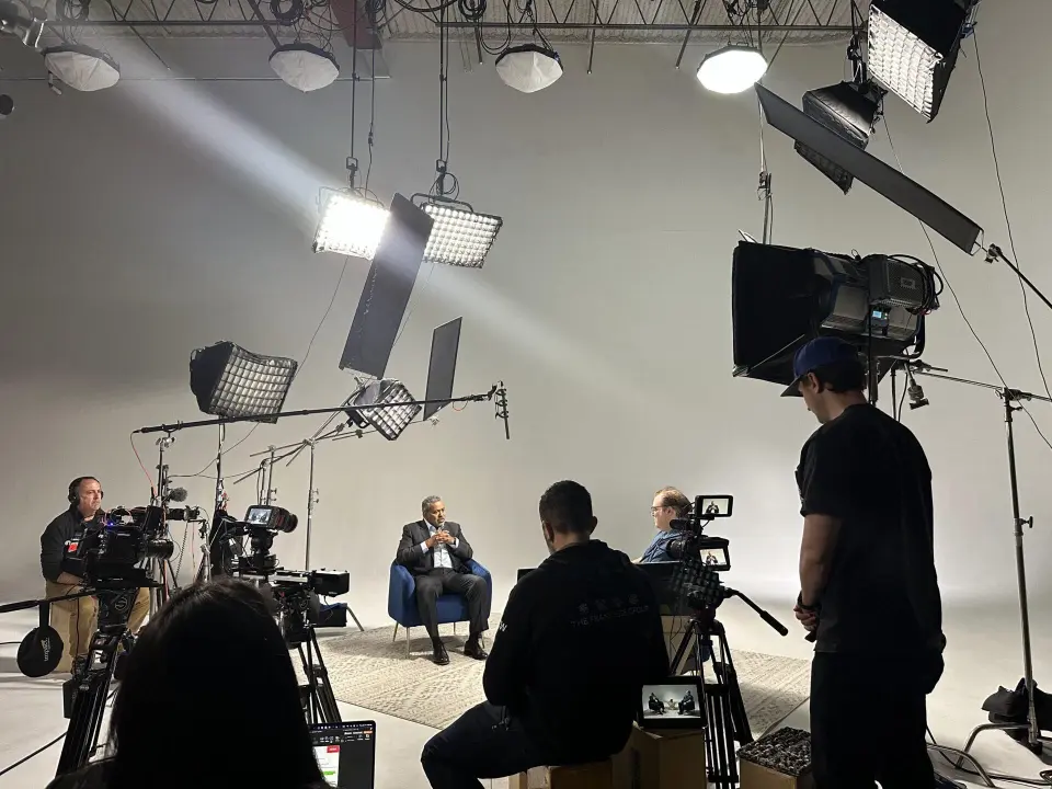 professional video production pricing crew with cinema camera director and gaffer on commercial brand shoot