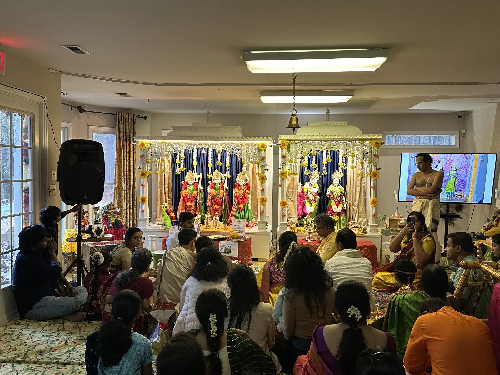 Gita discourse being given at the temple