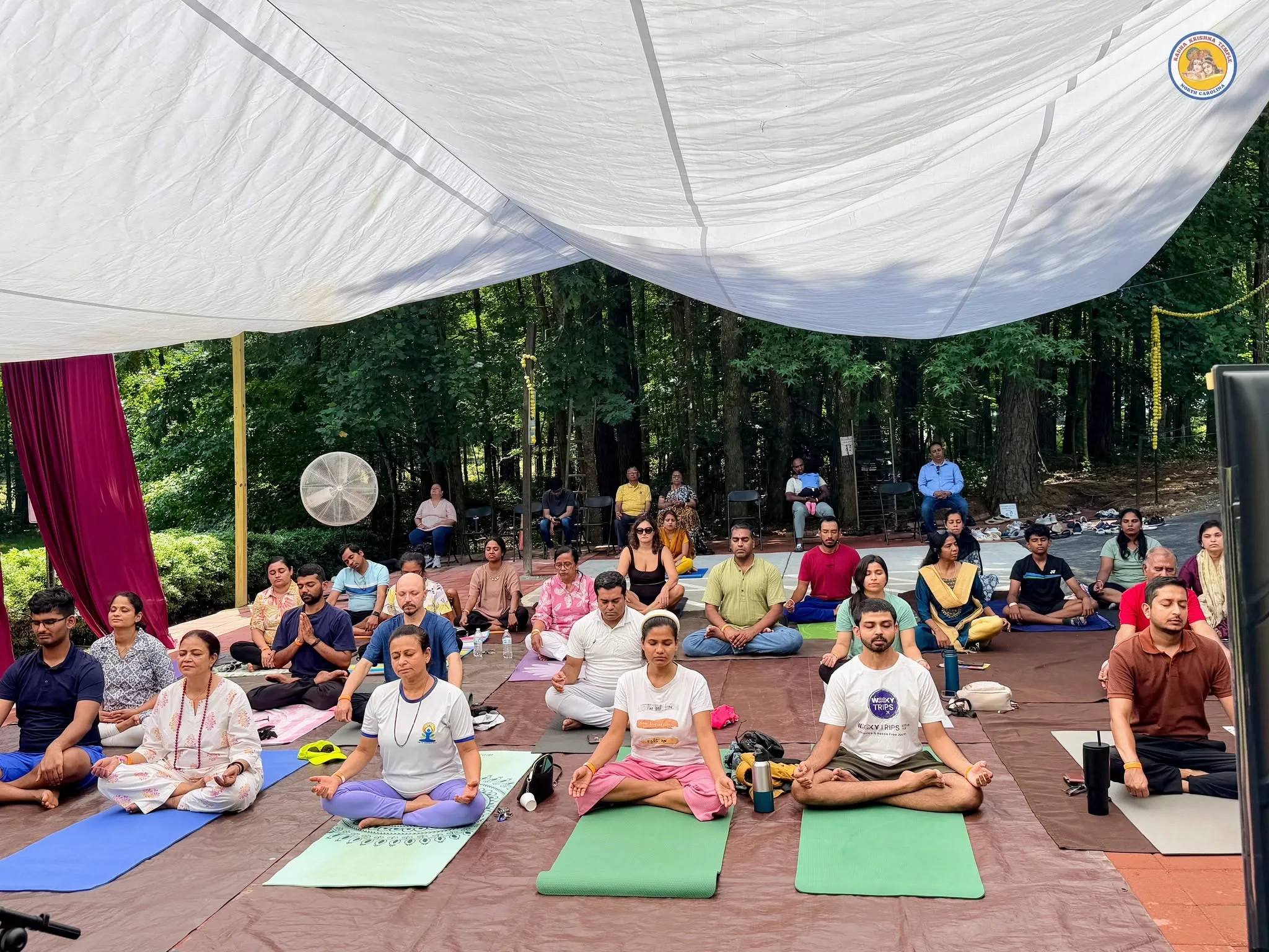 Devotees in guided meditation