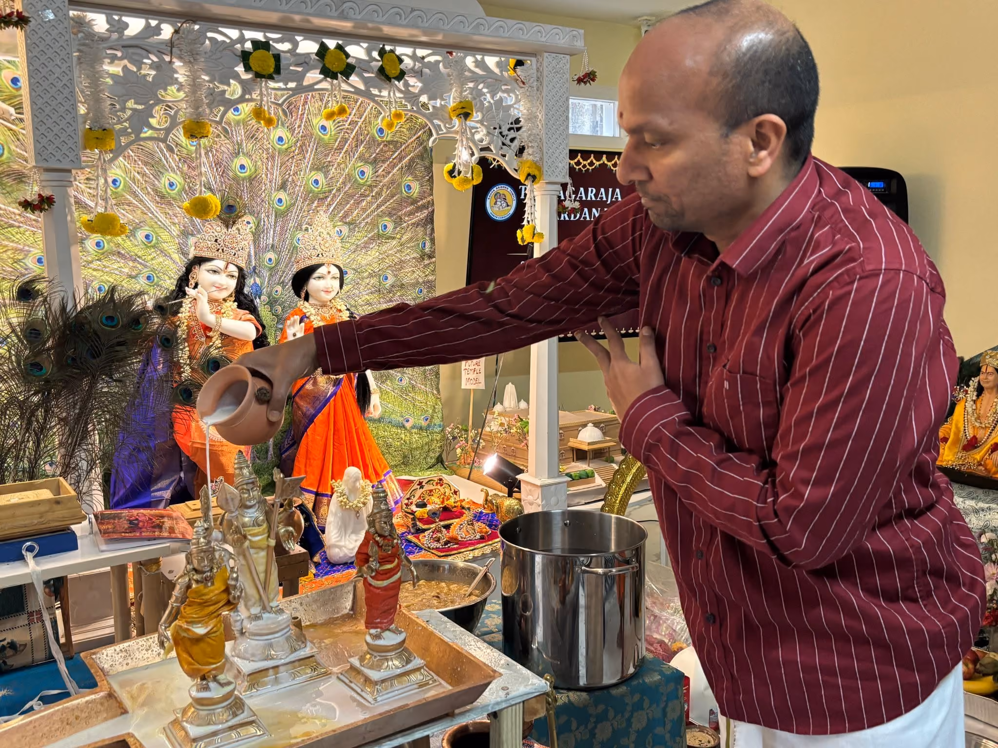Community gathered in worship of Lord Murugan