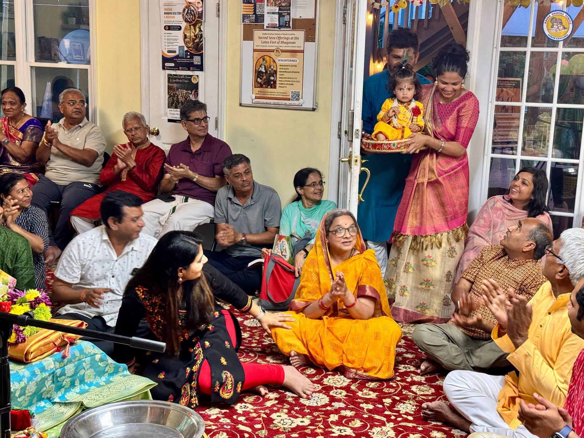 Devotees gathered lakeside for a temple procession
