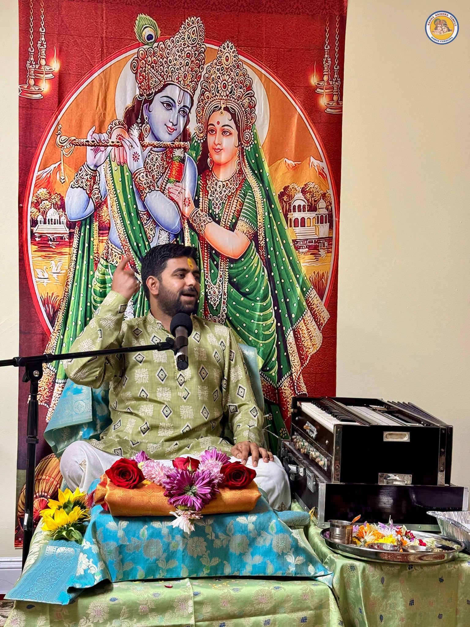 Devotees celebrating with the Krishna deity at Radha Krishna Temple of North Carolina