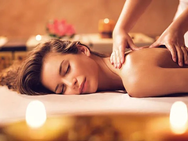 A woman receiving a deep tissue massage. 