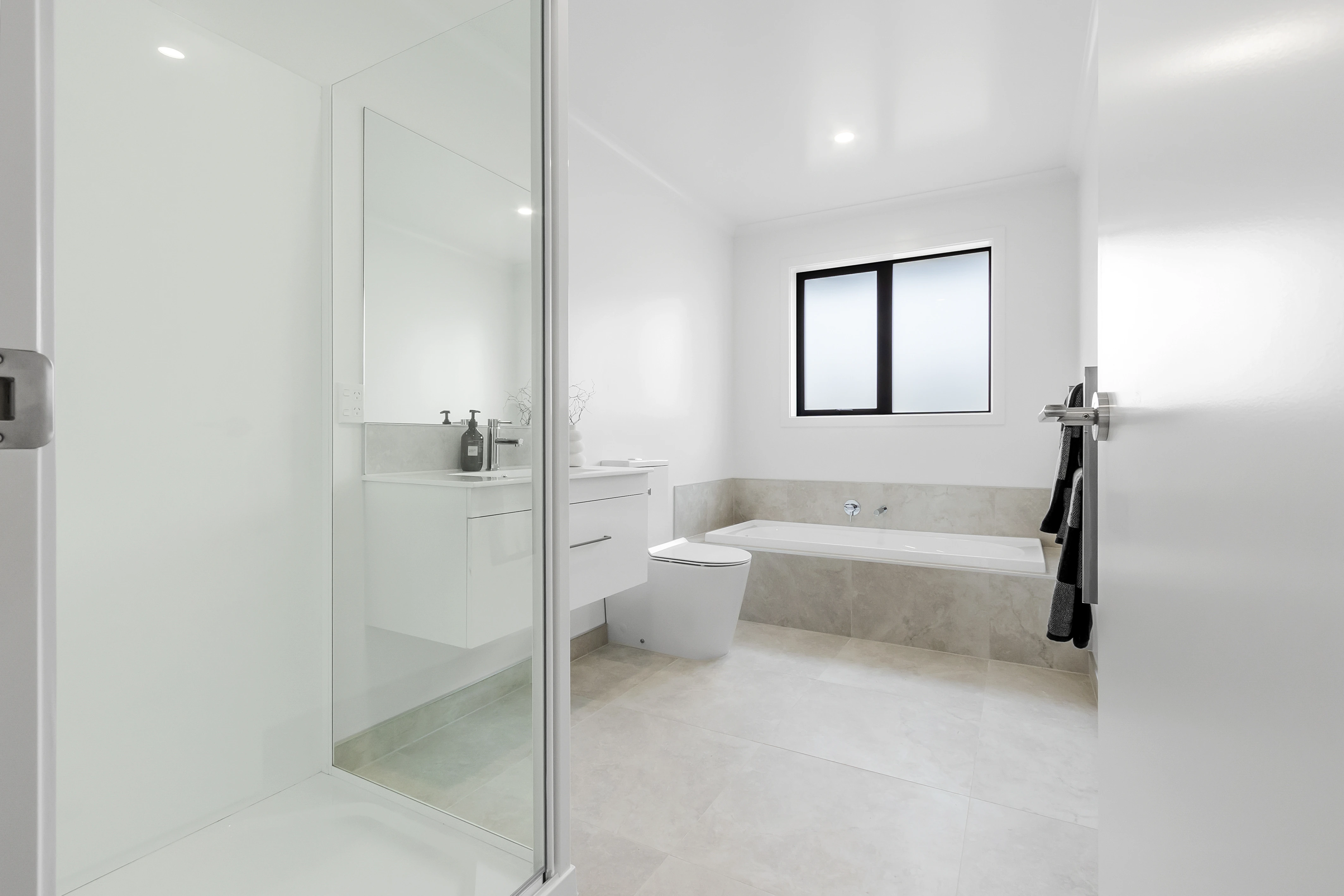 main bathroom with ensuite shower and bathtub