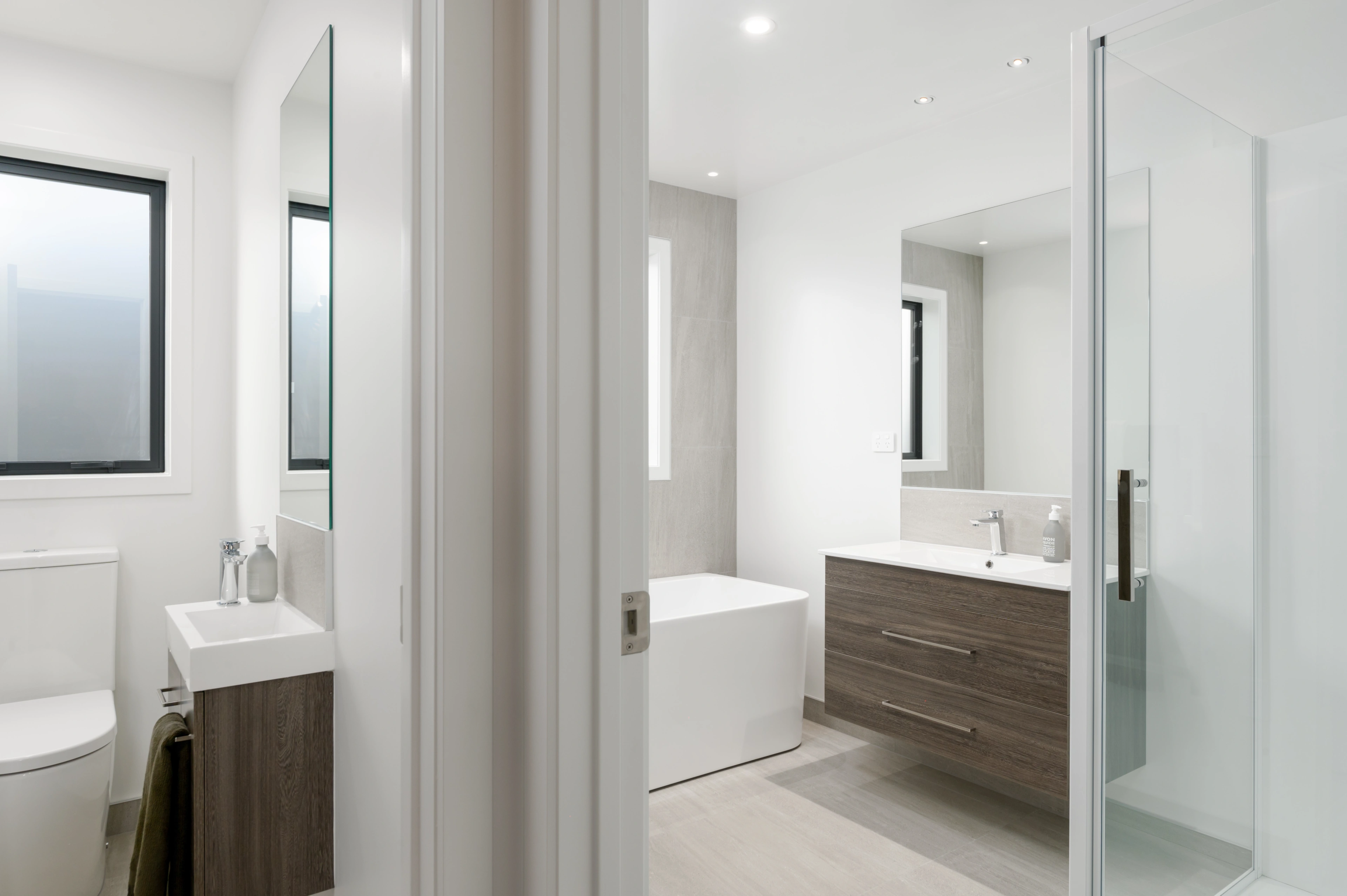separate toilet and bathroom with shower and bathtub