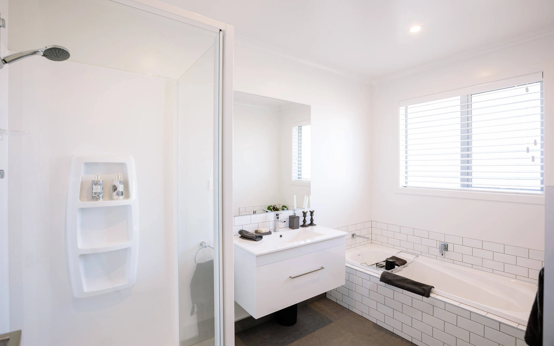 sleek bathroom with shower and bathtub