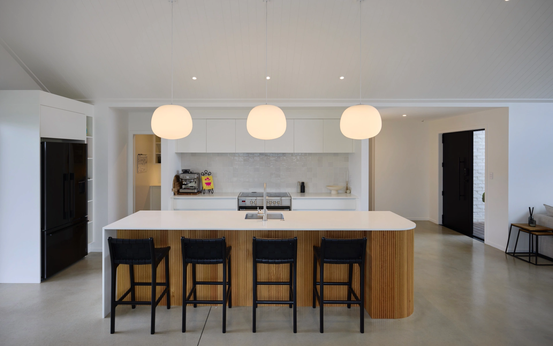 White kitchen design with light wooden features