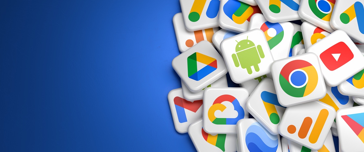Colorful 3D illustration of stacked Google app icon tiles, including Chrome, YouTube, Android and other Google services, on a blue background. Great for topics like apps, search, mobile OS, cloud services and digital ecosystems.
