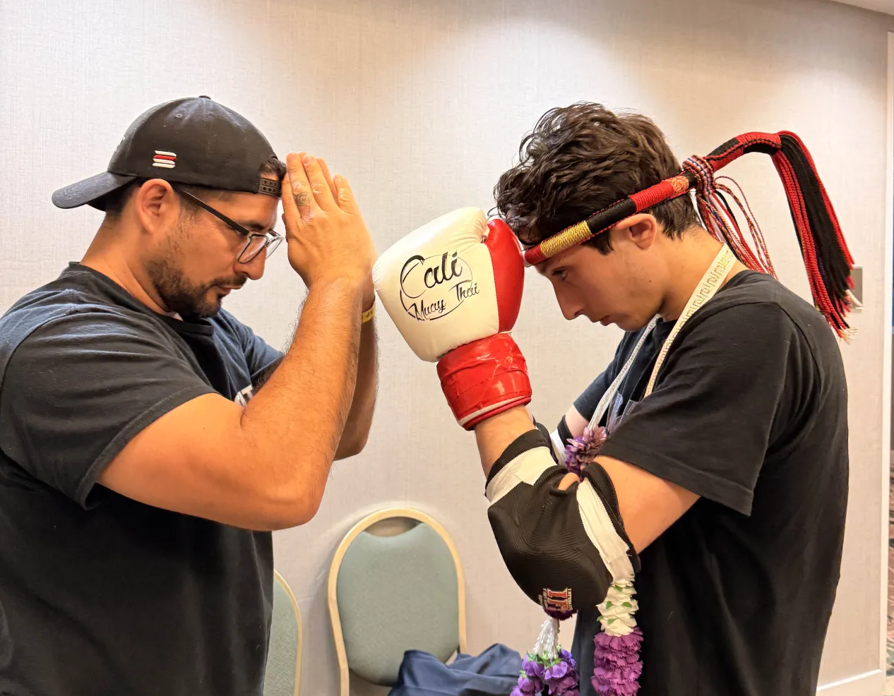 A coach and student bowing to each other before a fight. Showing respect and care for one another.