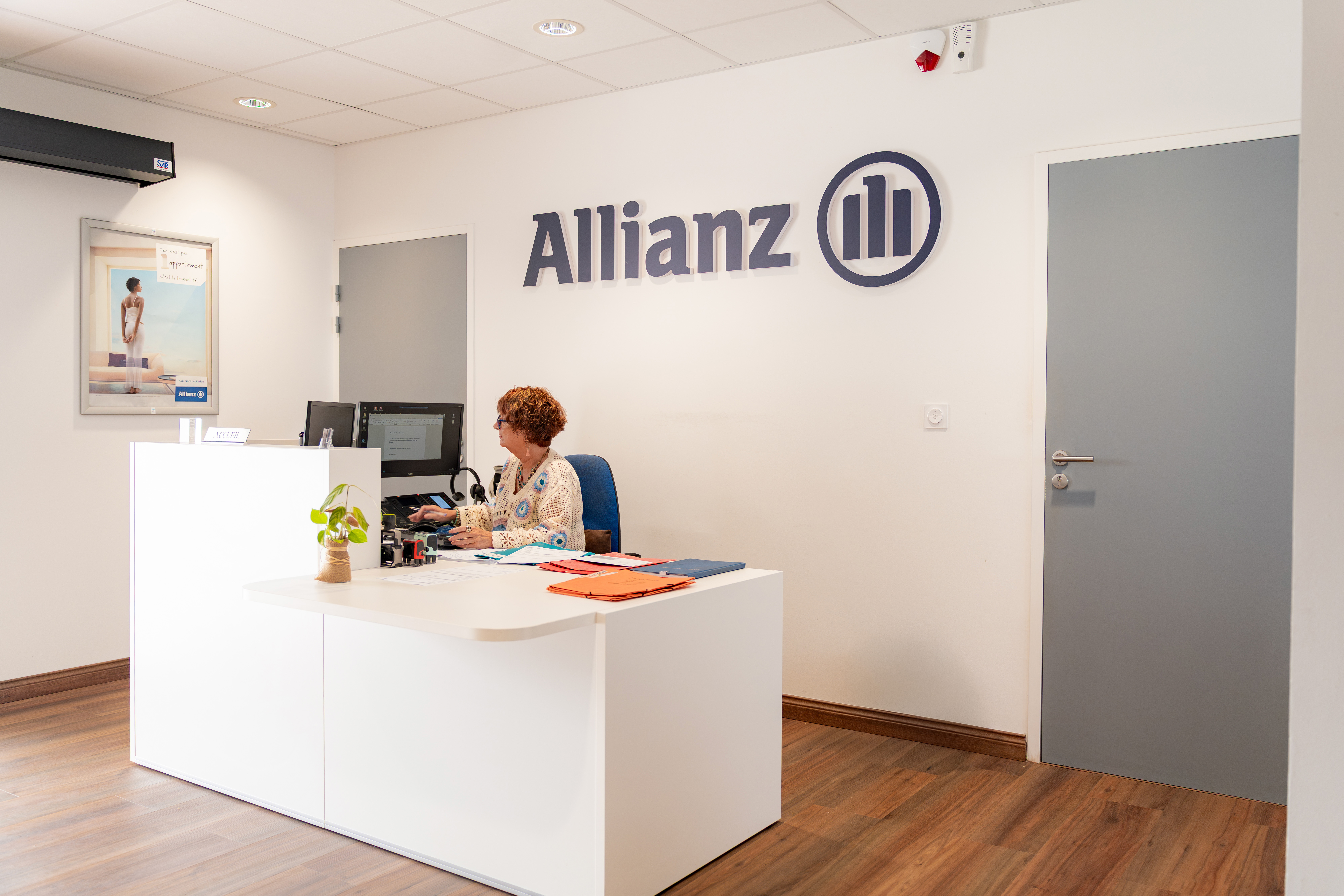 Image of woman holding sign