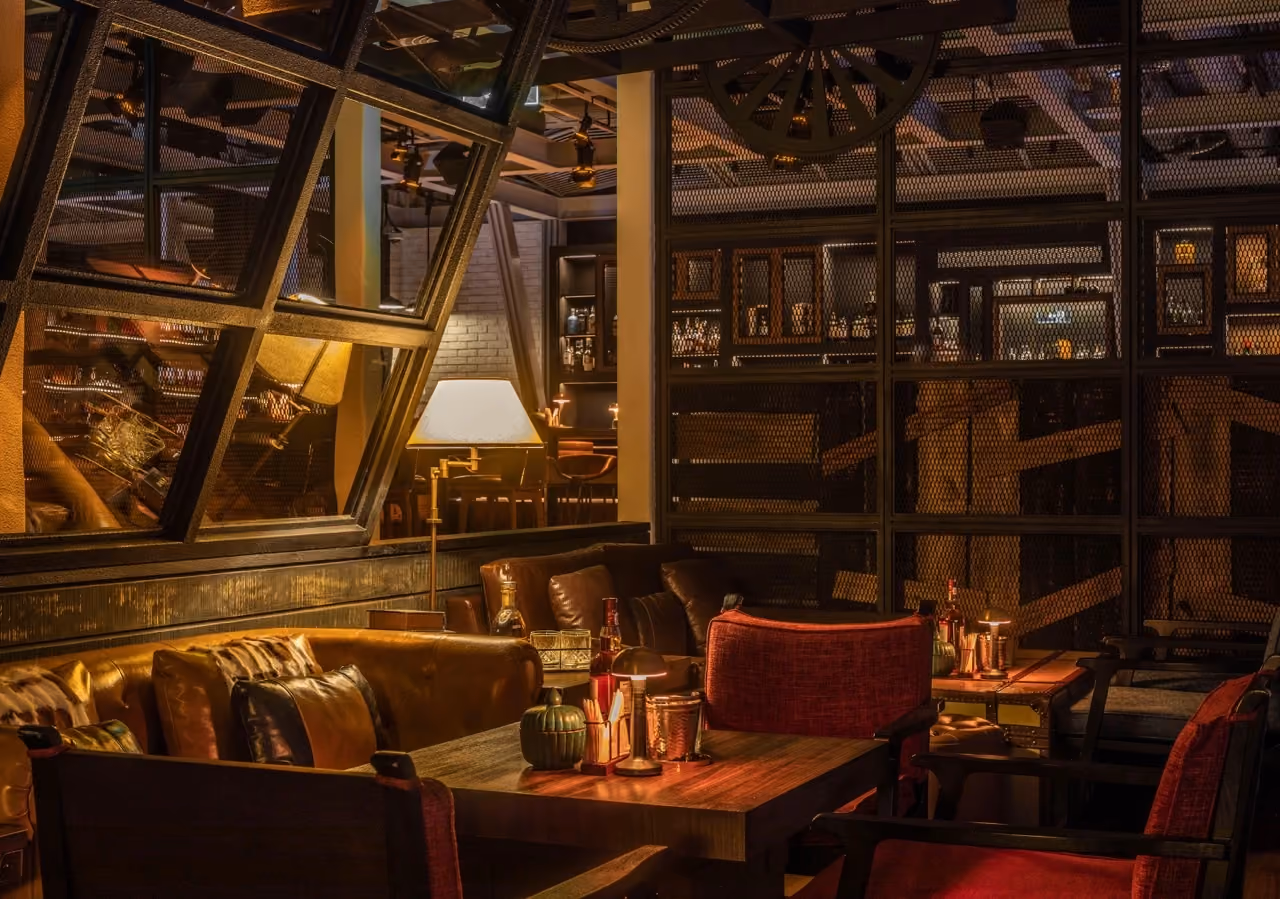 dim shot of the seating area with warm lights of prohibition bar at mandarin oriental shenzhen